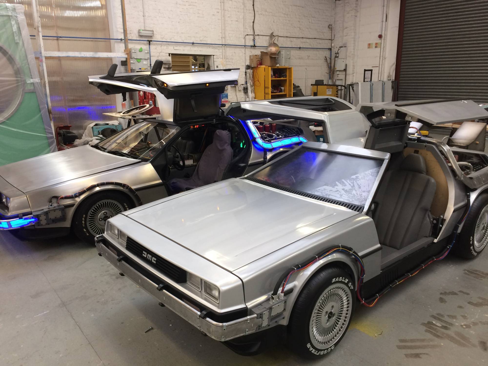 The BTTF Car DeLorean Time Machine Hire displayed with the BTTF Musical stage car as it was finished before being delivered to the Theatre